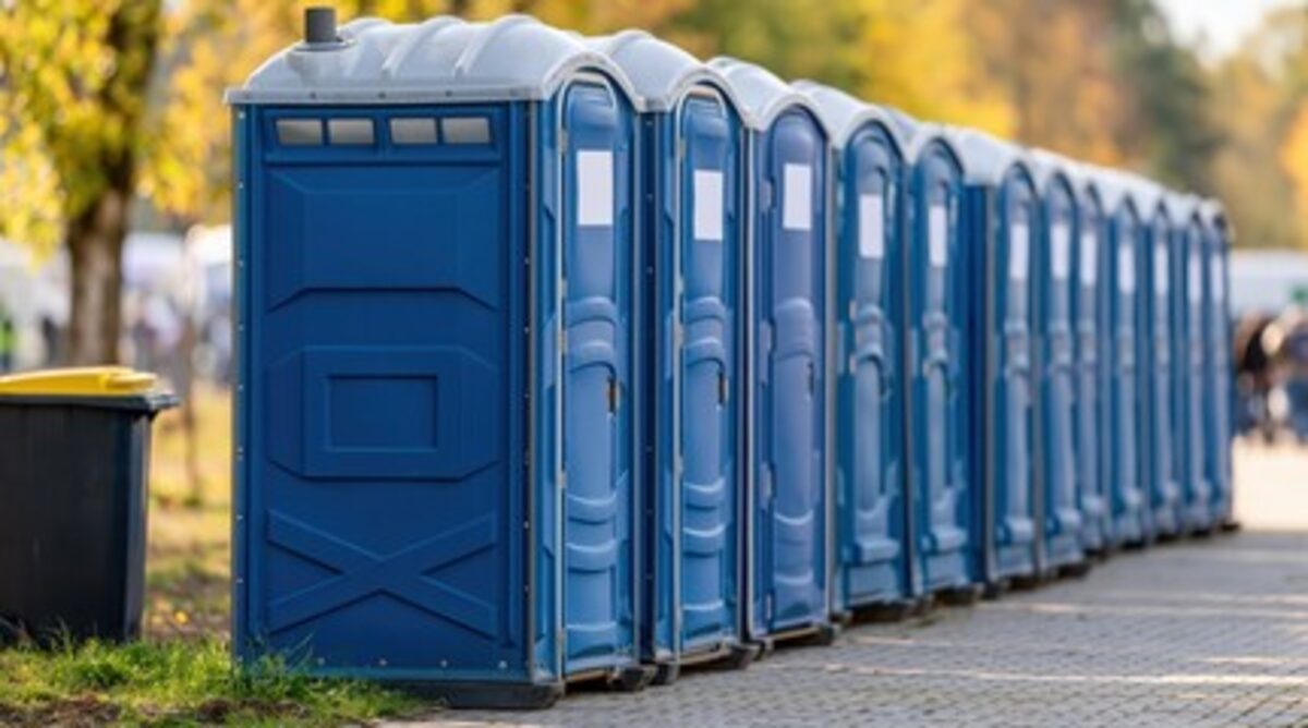 Standard portable toilet unit in an outdoor setting